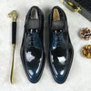 Close-up of handcrafted leather Oxfords showcasing premium cowhide material.