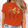 Floral print women's tee featuring 'Faith Hope Love' message, perfect for casual wear and versatile styling.