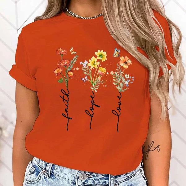 Floral print women's tee featuring 'Faith Hope Love' message, perfect for casual wear and versatile styling.