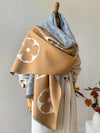 Luxe geometric shawl in soft gray, perfect for winter warmth and style.
