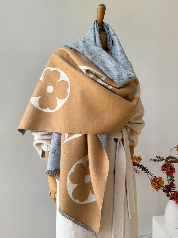 Luxe geometric shawl in soft gray, perfect for winter warmth and style.