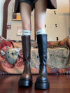 Chic black platform knee-high fashion boots with wedge heel, waterproof design, and bling accents for stylish women.
