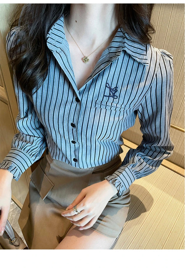 Chic striped blouse for office elegance, featuring a turn-down collar and single-breasted closure, perfect for professional w