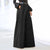 Chic wide leg palazzo pants for women in nylon-cotton blend, featuring pockets and button detail for stylish comfort.