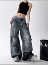 Trendy high-waist wide-leg ripped jeans for women with tie-dye and distressed detailing, perfect for casual street style.