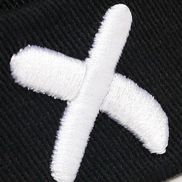 Docker cap side angle displaying sleek low-profile brimless design