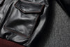 Vintage A2 leather flight jacket with a focus on the artisanal hand-rubbed finish.