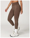 Teal seamless yoga leggings with flattering ribbed design.