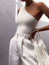 High-stretch cotton polyester crop tank featuring modern asymmetric design