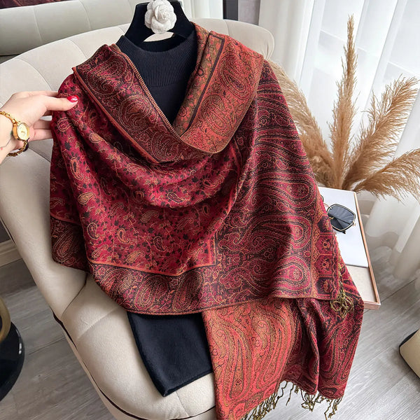 Tassel detail on lightweight paisley pashmina scarf displayed elegantly.