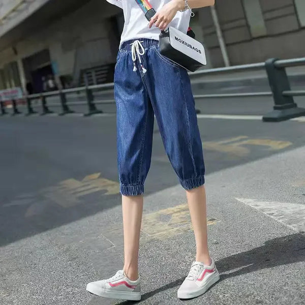 Women's high-waist harem jeans featuring breathable fabric and versatile calf-length fit