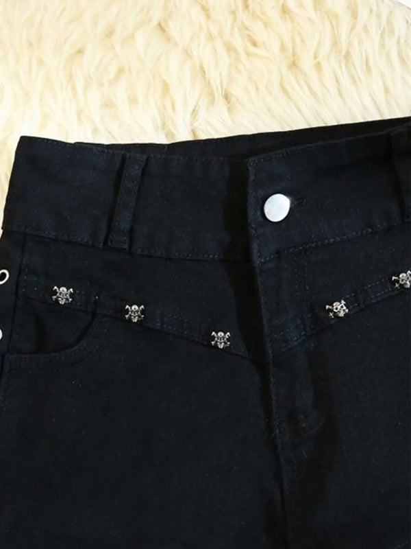 Edgy denim shorts with metal rivet accents and side lacing worn with casual streetwear outfit