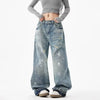 Trendy washed and ripped wide-leg women's jeans with ink-splashed finish, mid-rise, and comfortable cotton-spandex blend.