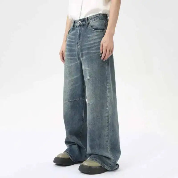 Vintage-inspired washed blue denim jeans with wide leg cut for men