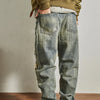 Rebel Spirit Distressed Jeans laid flat, emphasizing the stonewashed finish and relaxed fit.