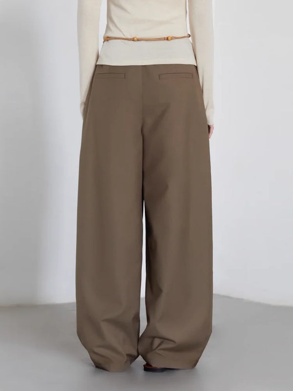 Modern pleated trousers in breathable polyester rayon blend with relaxed wide leg cut