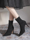 Chic black ankle boots with slim high heels, pointed toe design, perfect for autumn and winter fashion.