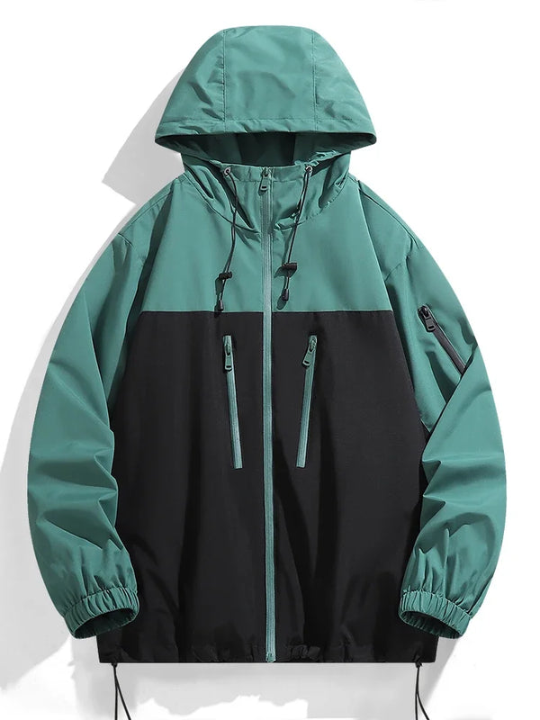 Men's waterproof hiking and urban windbreaker jacket with full-zip closure, oversized fit, and ribbed cuffs for warmth.