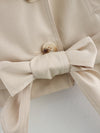 Wrinkle-resistant polyester trench in timeless double-breasted style