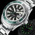 Side view of Yelang V1214 highlighting its sleek stainless steel design.