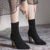 Chic black ankle boots with slim high heels, pointed toe design, perfect for autumn and winter fashion. Stylish slip-on footw