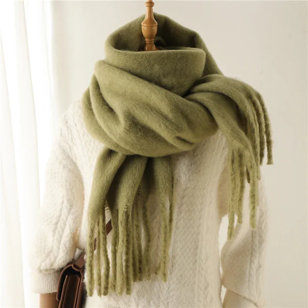 Chic cashmere-feel scarf in soft mint green with elegant design.