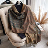 Fashionable paisley scarf with luxurious tassel detailing.