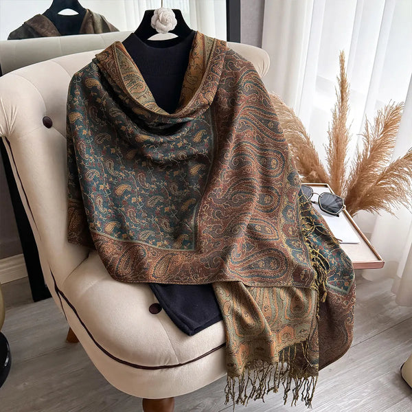 Fashionable paisley scarf with luxurious tassel detailing.