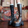 Chic black platform knee-high fashion boots with wedge heel, waterproof design, and bling accents for stylish women.