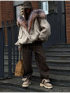 Cozy Rebellion jacket paired with leggings and sneakers for casual style