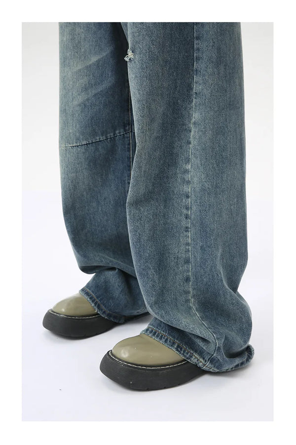 Washed blue wide leg jeans with classic styling and modern comfort features