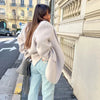 Creamy white mohair blazer styled with denim jeans for effortless casual elegance