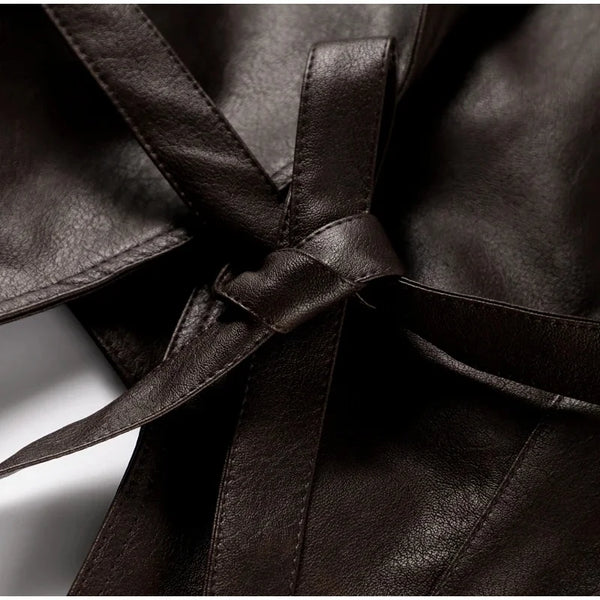 Chic belted leather bomber jacket for women, featuring a slim fit, lace-up detail, and hood, perfect for autumn and winter.
