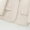 Front button detail and pocket placement on creamy white mohair blazer