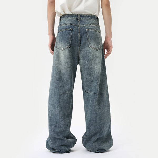 Men's loose fit wide leg jeans with washed blue finish and functional pockets