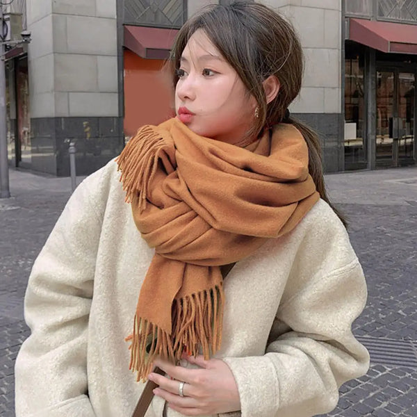 Cozy black cashmere blend scarf, perfect for layering in winter.