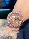 Timeless Whisper watch with a genuine leather strap and diamond embellishments.
