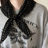 Triangular bohemian scarf perfect for spring and autumn wear.