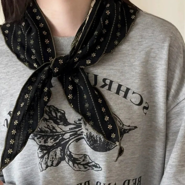 Triangular bohemian scarf perfect for spring and autumn wear.