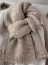 Warm scarf for women displayed against a winter backdrop, perfect for seasonal fashion.
