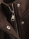 Belted jacket showing relaxed silhouette and flattering waist definition