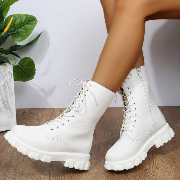 Chic white ankle boots with chunky heel, lace-up closure, and durable PU leather for stylish fall/winter wear.