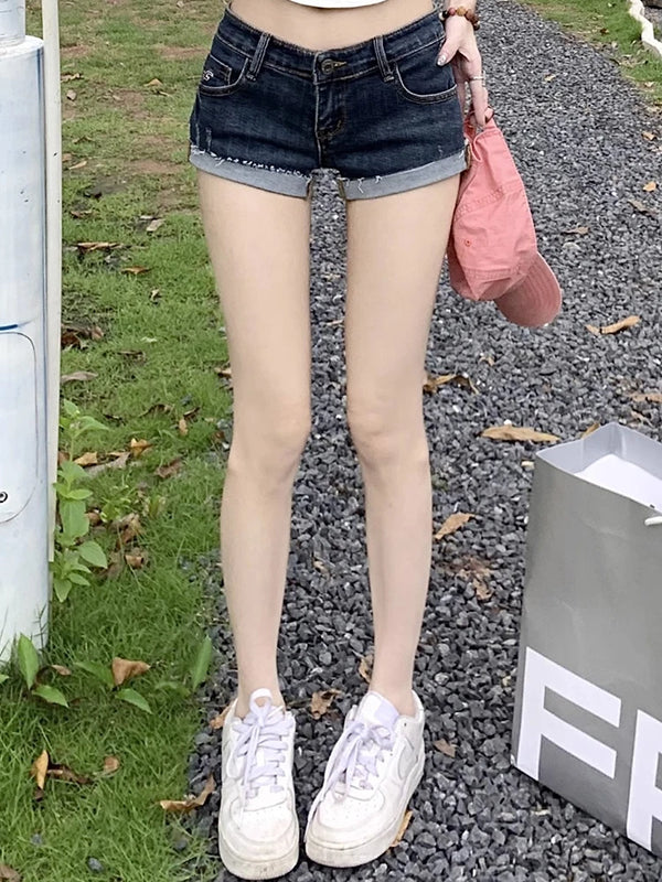 Light blue denim shorts featuring button-front closure and classic five-pocket styling