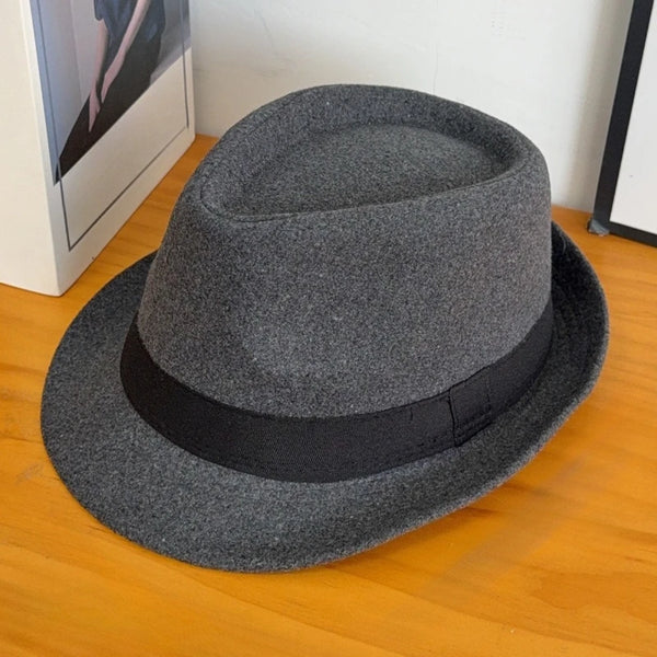 Charming black hat, perfect for winter strolls.