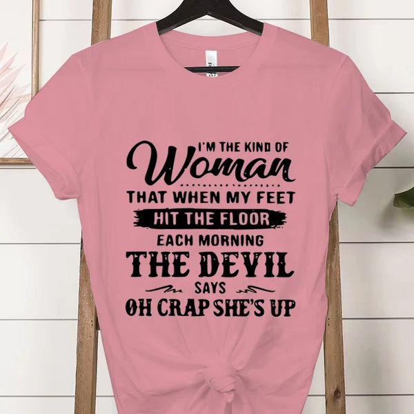 Bold statement tee celebrating female empowerment styled with skirt for chic casual look