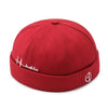 Brimless docker hat in black styled with streetwear outfit