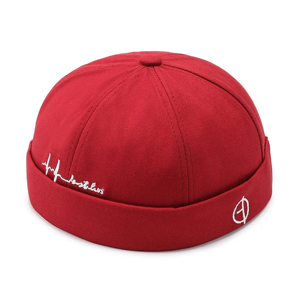 Brimless docker hat in black styled with streetwear outfit