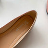 Side profile of pointed toe knitted ballet flats showing elegant silhouette