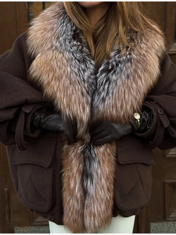 Hood up on Cozy Rebellion plush jacket for unexpected weather