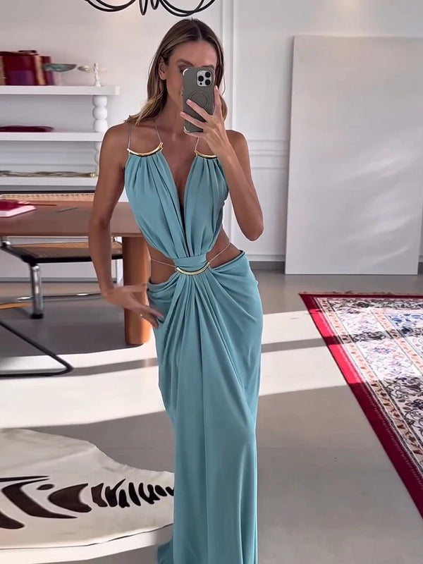 Ankle-length backless dress with halter neckline and flattering waist cutout details
